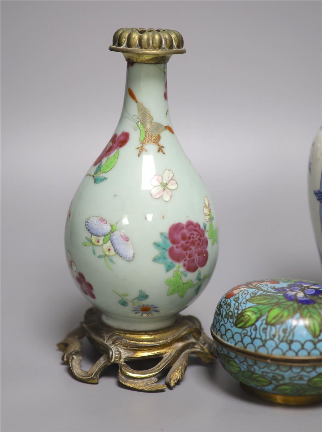 A 19th century Chinese famille rose and ormolu mounted vase, a blue and white vase and a cloisonne enamel box and cover, tallest 21cm